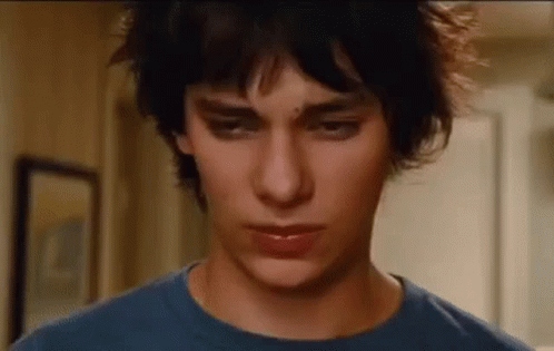A Close Up Of A Young Man Wearing A Blue Shirt . GIF
