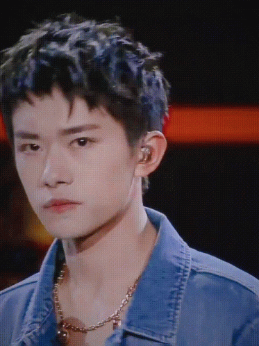 A Close Up Of A Young Man Wearing A Denim Jacket GIF