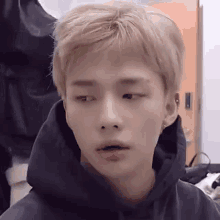 A Close Up Of A Young Man Wearing A Hoodie . GIF