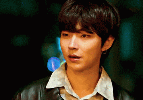 A Close Up Of A Young Man Wearing A Leather Jacket And A White Shirt GIF