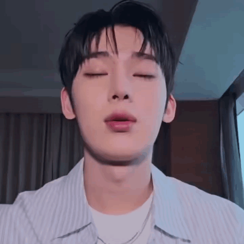 A Close Up Of A Young Man With His Eyes Closed . GIF