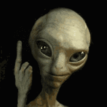 A Close Up Of An Alien Making A Middle Finger Sign GIF