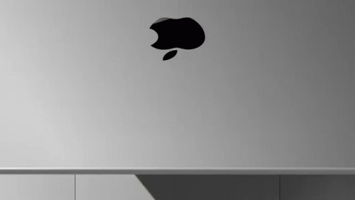 A Close Up Of An Apple Logo On A Laptop . GIF