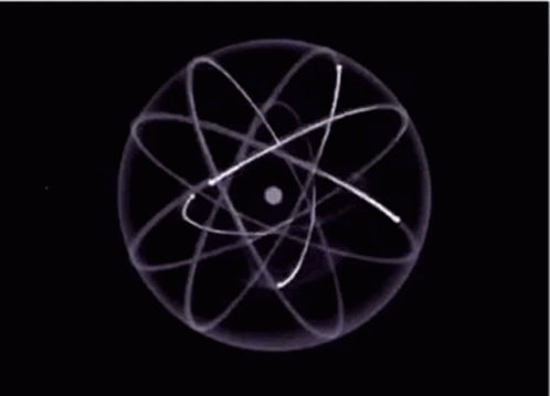A Close Up Of An Atom With A Black Background And White Lines Around It . GIF