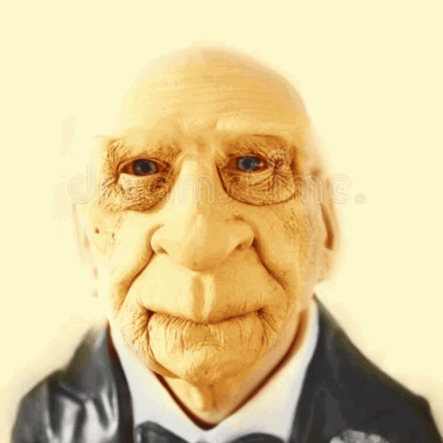 A Close Up Of An Elderly Man 'S Face Wearing A Suit And Bow Tie GIF