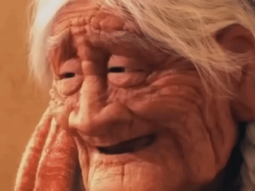 A Close Up Of An Elderly Woman 'S Face With Her Eyes Closed . GIF