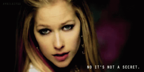 A Close Up Of Avril Lavigne With The Words No It 'S Not A Secret Below Her GIF