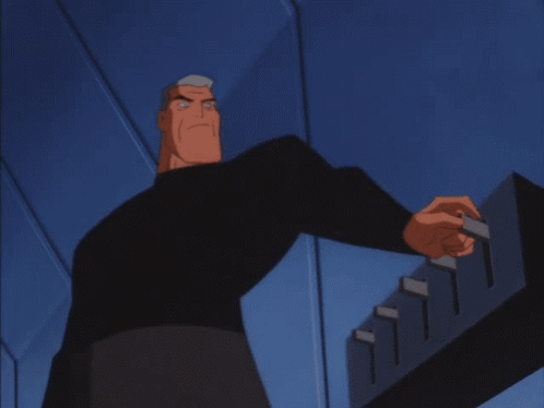 A Close Up Of Batman 'S Face With A Blue Background GIF