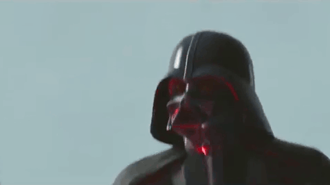 A Close Up Of Darth Vader 'S Face With A Red Background . GIF