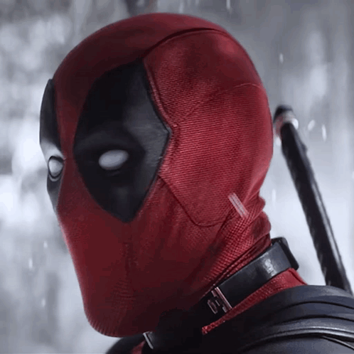 A Close Up Of Deadpool 'S Face With A Collar GIF