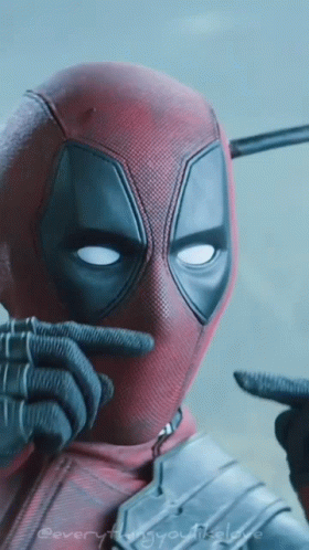 A Close Up Of Deadpool 'S Face With The Words " Everything You Need " Written On The Bottom GIF