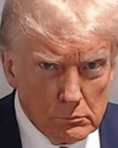 A Close Up Of Donald Trump 'S Face In A Suit And Tie Making An Angry Face . GIF
