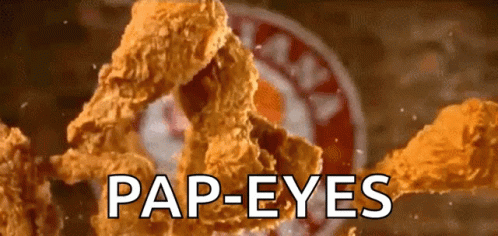 A Close Up Of Fried Chicken With The Words Pap-Eyes Written Below It GIF