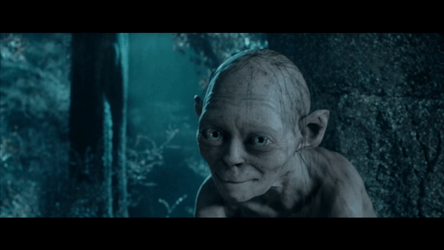 A Close Up Of Gollum From The Lord Of The Rings Looking At The Camera GIF