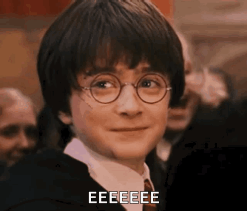 A Close Up Of Harry Potter Wearing Glasses And A Tie With The Words Eeeeee Written Below Him . GIF