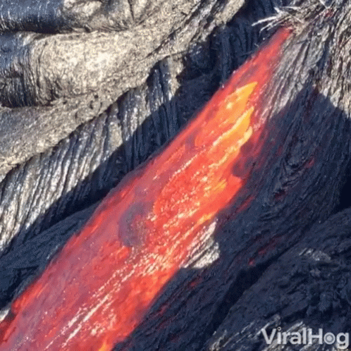 A Close Up Of Lava Flowing From A Volcano With Viralhog Written On The Bottom GIF