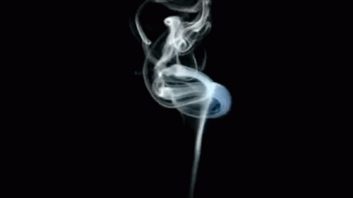 A Close Up Of Smoke Coming Out Of A Pipe On A Black Background GIF