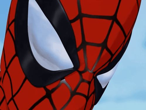 A Close Up Of Spider Man 'S Face With A Blue Sky In The Background GIF