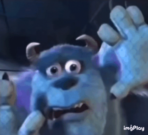 A Close Up Of Sulley From Monsters Inc Making A Scary Face . GIF
