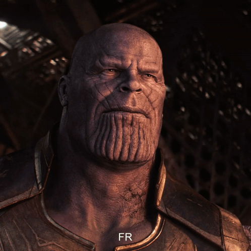 A Close Up Of Thanos ' Face With The Letters Fr Below Him GIF