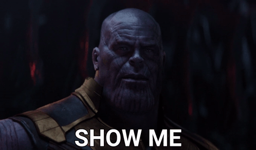 A Close Up Of Thanos With The Words Show Me Above Him GIF