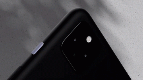 A Close Up Of The Back Of A Black Cellphone GIF