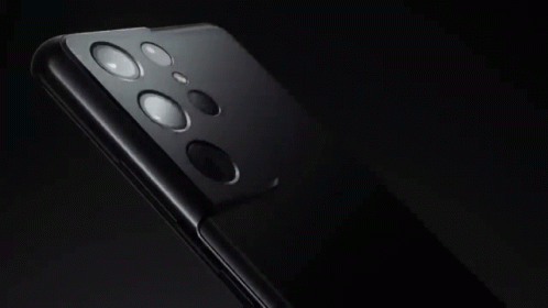 A Close Up Of The Back Of A Cell Phone Showing The Camera Lenses GIF