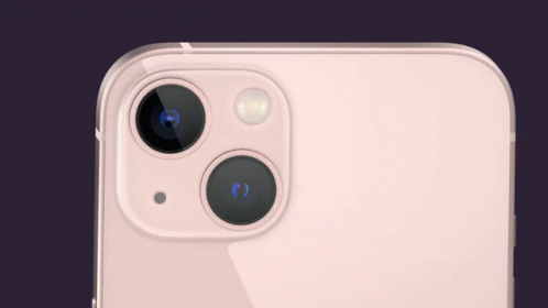 A Close Up Of The Back Of An Iphone With A Pink Screen GIF