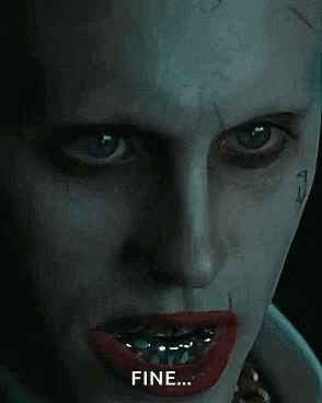 A Close Up Of The Face Of The Joker From The Movie Suicide Squad With Braces On His Teeth . GIF