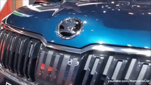 A Close Up Of The Hood Of A Blue Skoda GIF