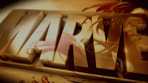 Close Up Of Marvel Word With Woman Drawing In Background GIF
