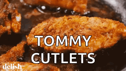 A Close Up Of Tommy Cutlets In A Pan GIF