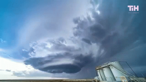 A Cloudy Sky With The Letters Th On The Bottom Left GIF