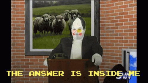 A Clown Stands At A Podium With A Picture Of Sheep Behind Him And The Words The Answer Is Inside Me GIF