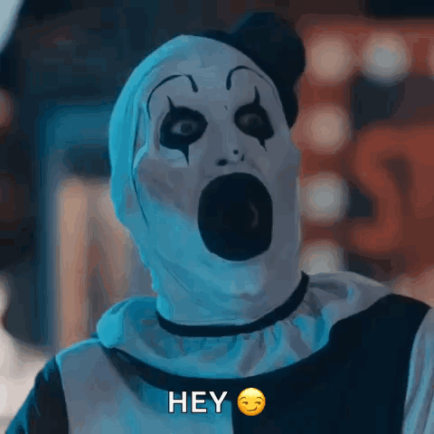 A Clown With A Surprised Look On His Face Is Saying " Hey " GIF