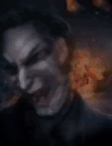 A Collage Of Images Of A Woman 'S Face With A Fire Background GIF