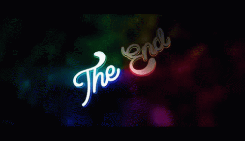 A Colorful Background With The Words `` The End '' Glowing In The Dark . GIF