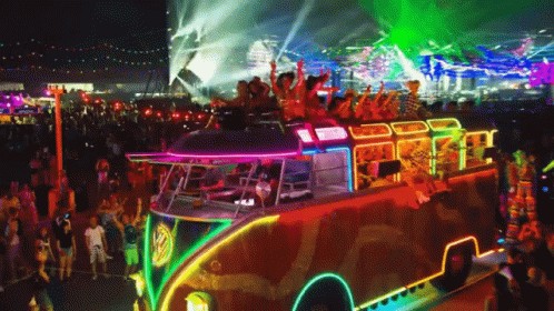 A Colorful Bus With A Vw Logo On It GIF