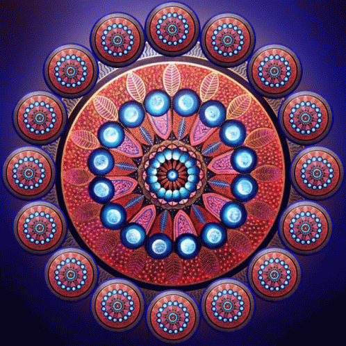 A Colorful Circular Pattern With Blue Circles And Leaves GIF
