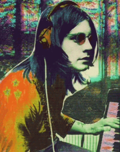 A Colorful Painting Of A Woman Playing A Piano GIF