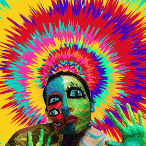 A Colorful Painting Of A Woman 'S Face With A Skeleton In The Background GIF
