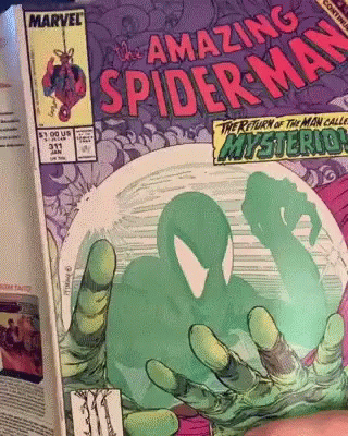A Comic Book Called The Amazing Spider Man GIF