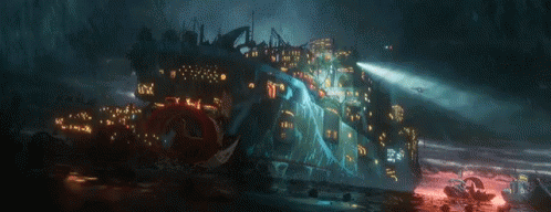 A Computer Generated Image Of A Futuristic City With A Lot Of Lights On It GIF