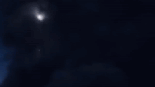 A Computer Generated Image Of A Robot With A Purple Light Coming Out Of It GIF