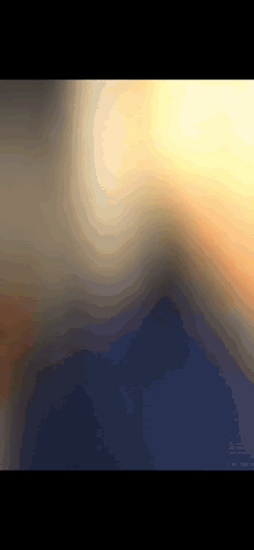 A Computer Generated Image Of A Sunset With Mountains In The Distance GIF