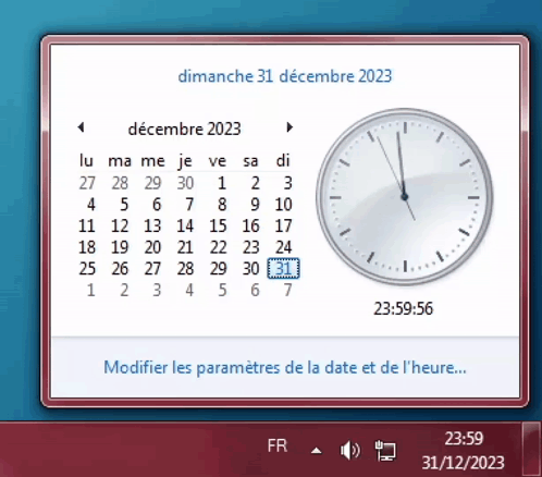A Computer Screen Shows A Calendar And A Clock On Dimanche 31 Decembre 2023 GIF