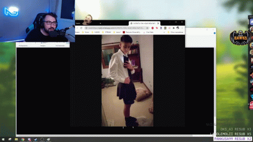 A Computer Screen Shows A Man Speaking Into A Microphone And A Woman In A Skirt GIF