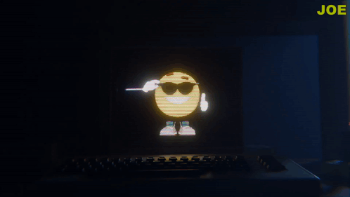 A Computer Screen With A Smiley Face And The Word Joe In Yellow GIF