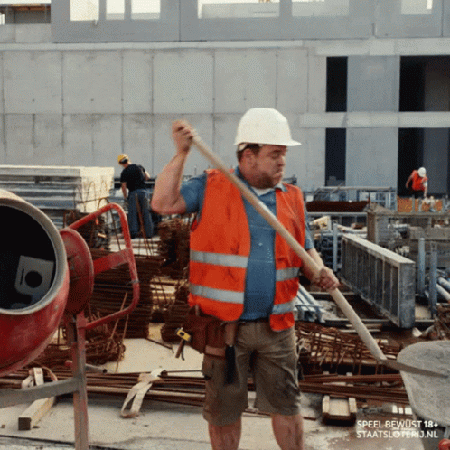 A Construction Worker Wearing An Orange Vest And A White Hard Hat Is Holding A Shovel GIF
