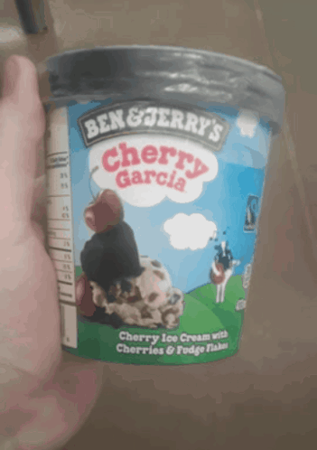A Container Of Ben & Jerry 'S Cherry Garcia Ice Cream With Cherries And Fudge Flakes GIF